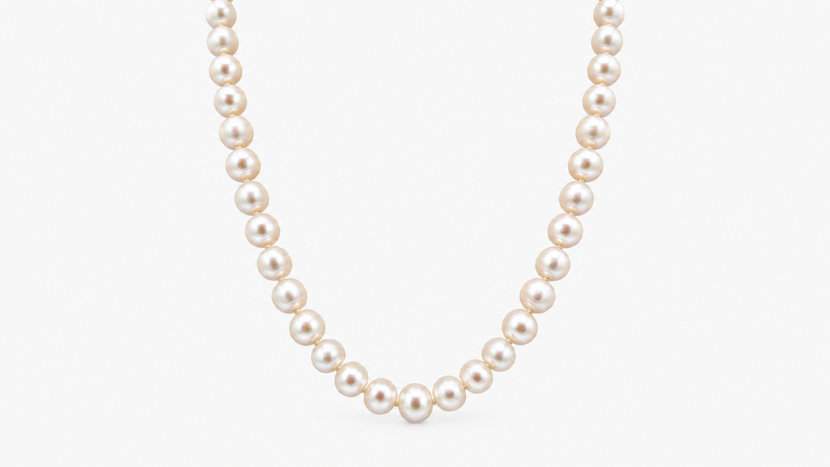 7.7mm Freshwater Pearl Necklace in 9ct yellow gold, front view on a light grey background