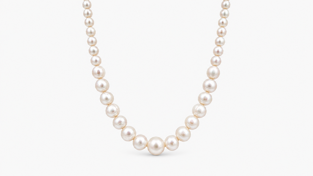 6.8–13mm Graduated Freshwater Pearl Necklace in 9ct yellow gold, front view on a light grey background