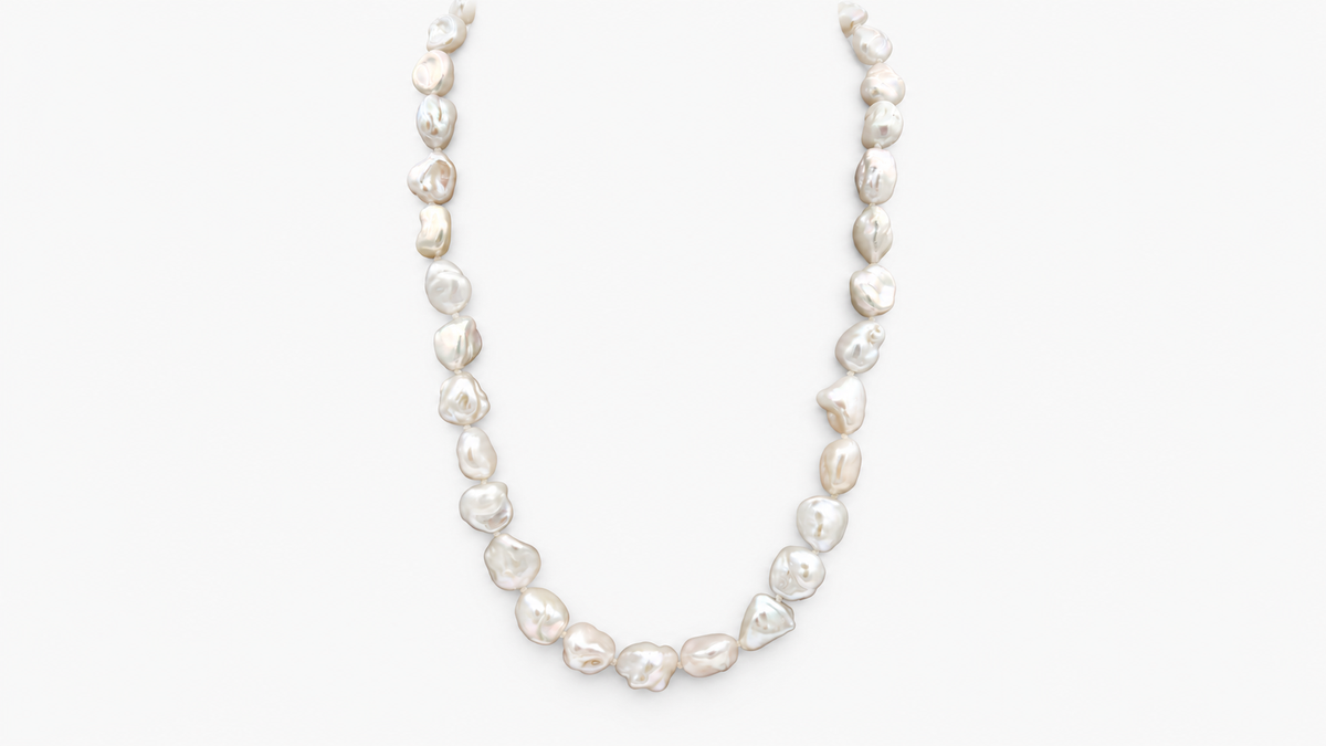 Keshi Pearl Necklace in 9ct yellow gold, front view on a light grey background