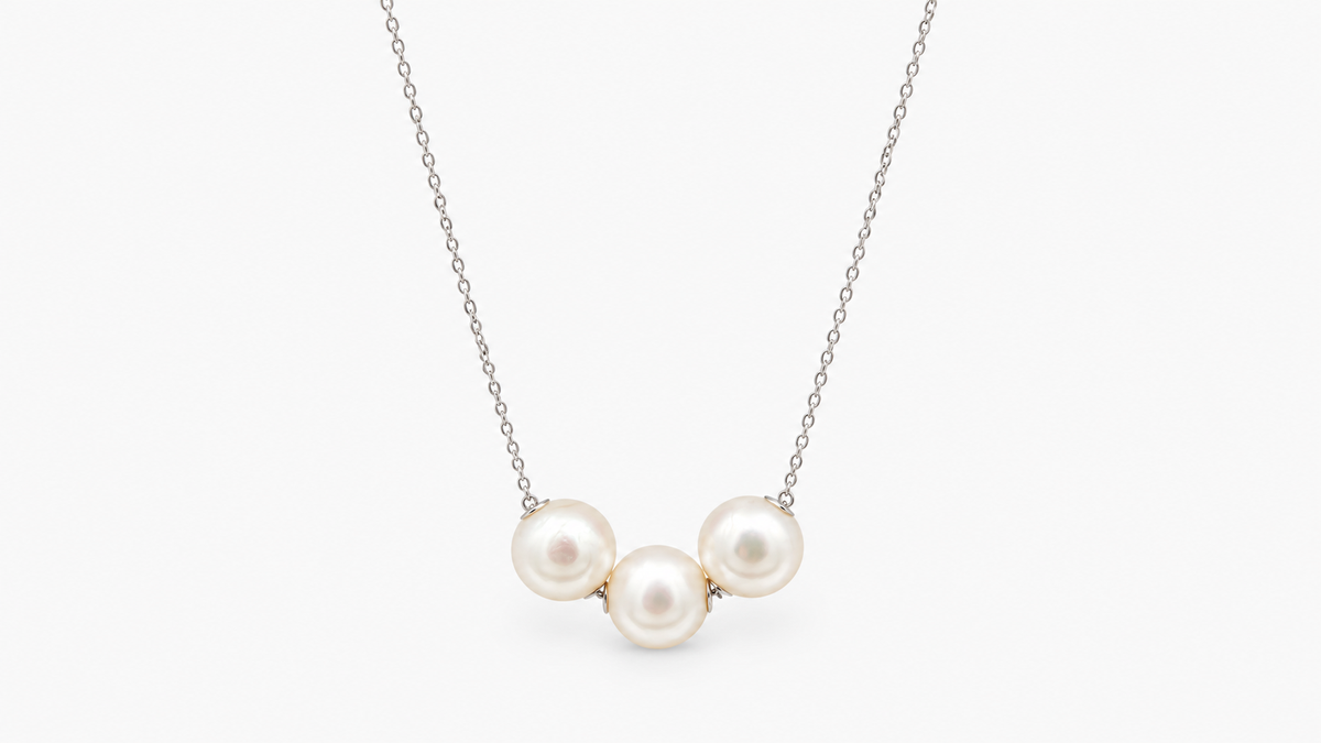 10mm Freshwater Pearl Trio Necklace in 10ct white gold, front view on a light grey background