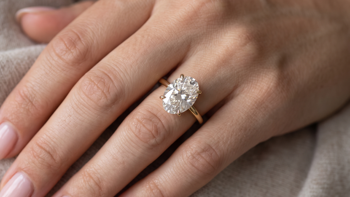 6.50ct Oval Lab Diamond Solitaire Ring shown on hand — SKU 9075