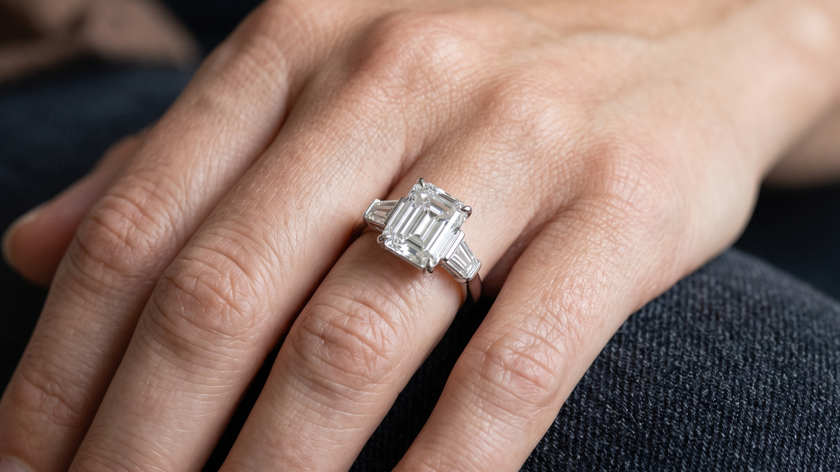 4.50ct Emerald Cut Trilogy Lab Diamond Ring shown on hand — SKU 9152
