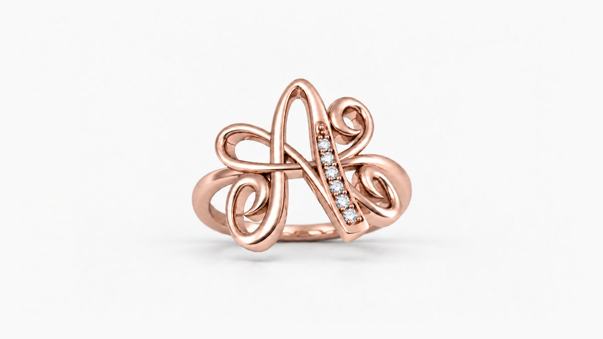 A diamond initial ring in polished rose gold, front view