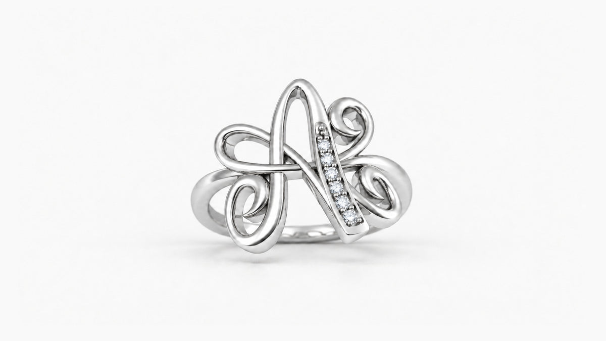 A diamond initial ring in polished white gold, front view