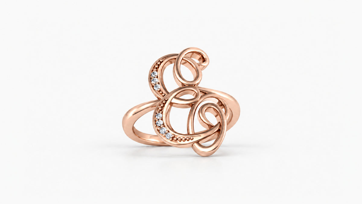 E diamond initial ring in polished rose gold, front view