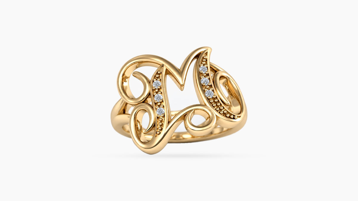 M diamond initial ring in polished yellow gold, front view