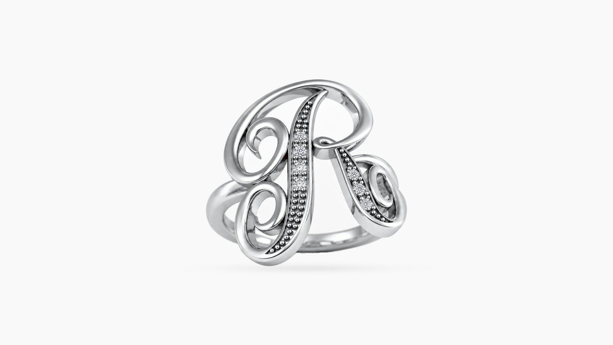 R diamond initial ring in polished white gold, front view