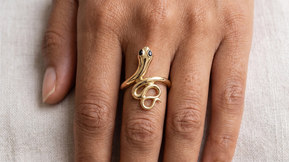 Black Onyx Snake Ring shown on hand — SKU 9870